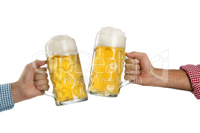 Cheers at the Oktoberfest in front of a white background