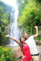 Hawaii tourist people happy by waterfall