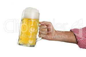 Man in traditional Bavarian shirt holds mug of beer