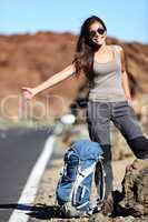 Travel hitchhiker woman happy