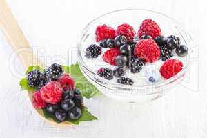 yogurt with forest berries in bowl