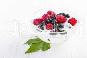 yogurt with forest berries in  bowl