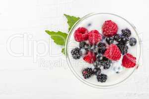 yogurt with forest berries in bowl