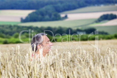 Man hiding in corn field