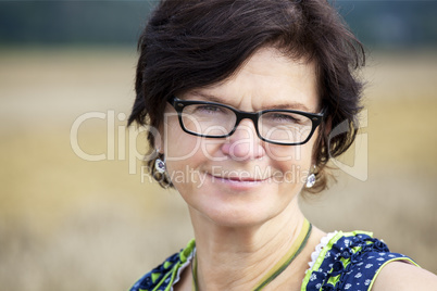 Portrait of woman in Dirndl on the field