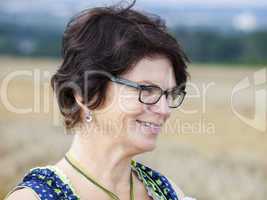 Portrait of woman in Dirndl on the field