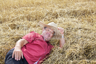 man who is down on straw and takes a rest