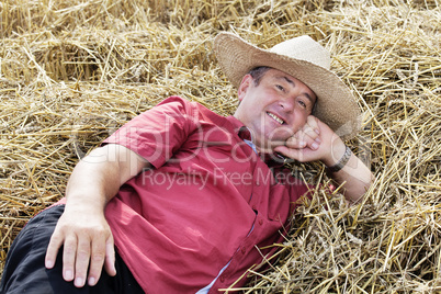 man who is down on straw and takes a rest