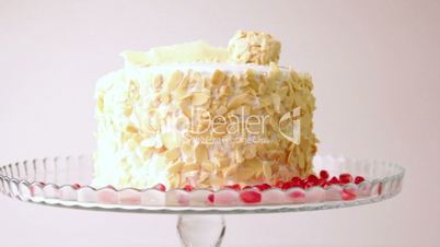 Festive cupcakes with almonds and fruit on a white background.