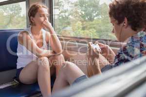 Teenagers boy and girl  in the train