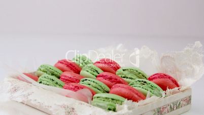 Festive colorful dessert pastry with almonds and fruit on a white background.