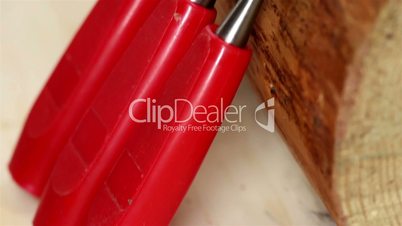 Three red chisels with different length