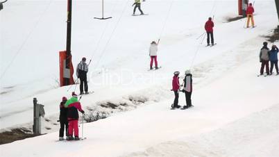 Tourists are skiing using the pulley