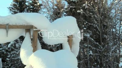 A triangular pole filled with snow