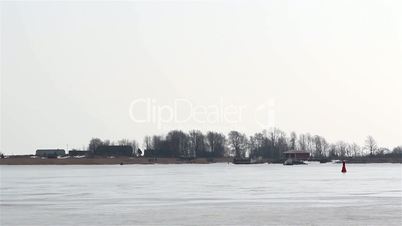 A view of an area with snow and a moving boat