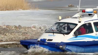 A blue boat with passengers on it