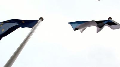 European and Estonia flag waving in the air