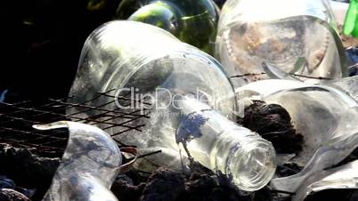 Some broken bottles on the garbage area