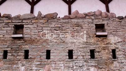 The stone wall of the old castle