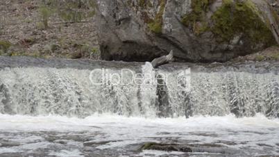 The slow motion of the rushing water