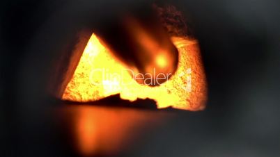 Flaming coals inside a steel