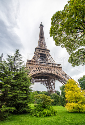 La Tour Eiffel in Paris surrounded by trees in summer