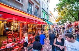 PARIS - JUNE 17, 2014: Tourists enjoy the evening on Montmartre