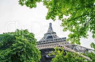 La Tour Eiffel in Paris surrounded by trees in summer