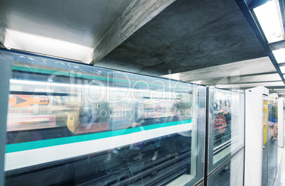 PARIS - JUNE 22, 2014: Underground train in metro station. More