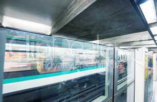 PARIS - JUNE 22, 2014: Underground train in metro station. More