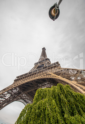 La Tour Eiffel in Paris surrounded by trees in summer