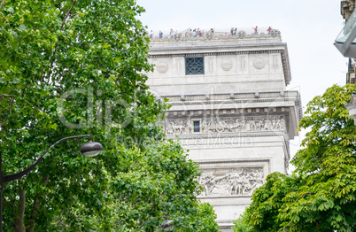 Arc de Triomphe in Paris - Side view framed by trees