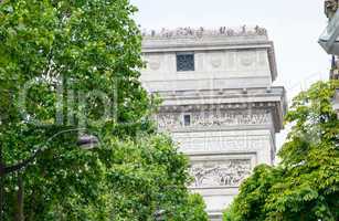 Arc de Triomphe in Paris - Side view framed by trees