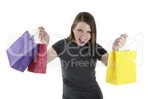 Excited shopping woman shouting with shopping bags