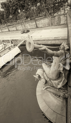 Paris. Sculpture on Mirabeau Bridge over Seine river