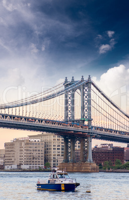 Boat under Manhattan Bridge