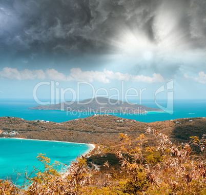 Island colors, aerial view against a dramatic sky