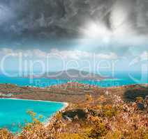 Island colors, aerial view against a dramatic sky