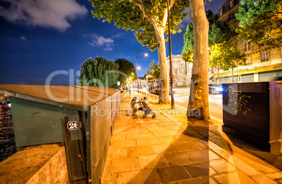 Paris with closed stalls along the river Seine at night