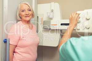 Woman patient ready to be scanned at X-Ray machine