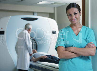 Happy young female doctor with man patient in background undergo