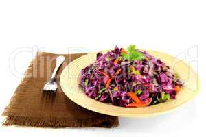 Red cabbage salad seasoned with carrots and celery