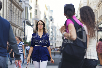 Cheerful urban girl at a city street