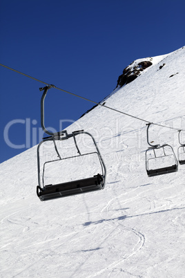 Chair-lift in ski resort at sun day Chair-lift in ski resort at sun day