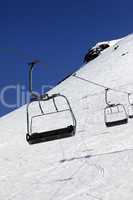 Chair-lift in ski resort at sun day