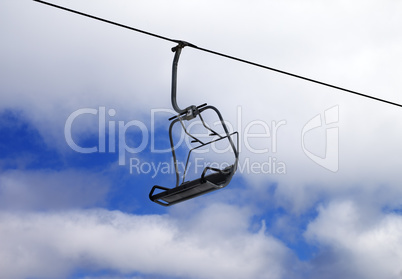 Chair-lift and cloudy sky