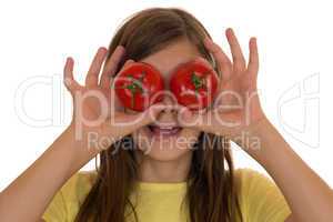 Gesunde Ernährung Mädchen mit Tomaten Gemüse auf den Augen