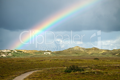 rainbow over dunes