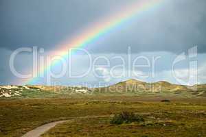 rainbow over dunes