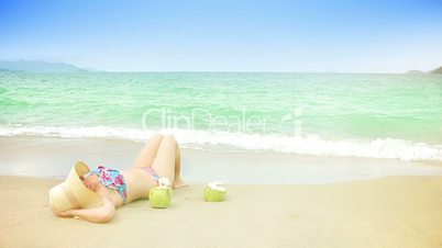 Young woman is relaxing on a beach.